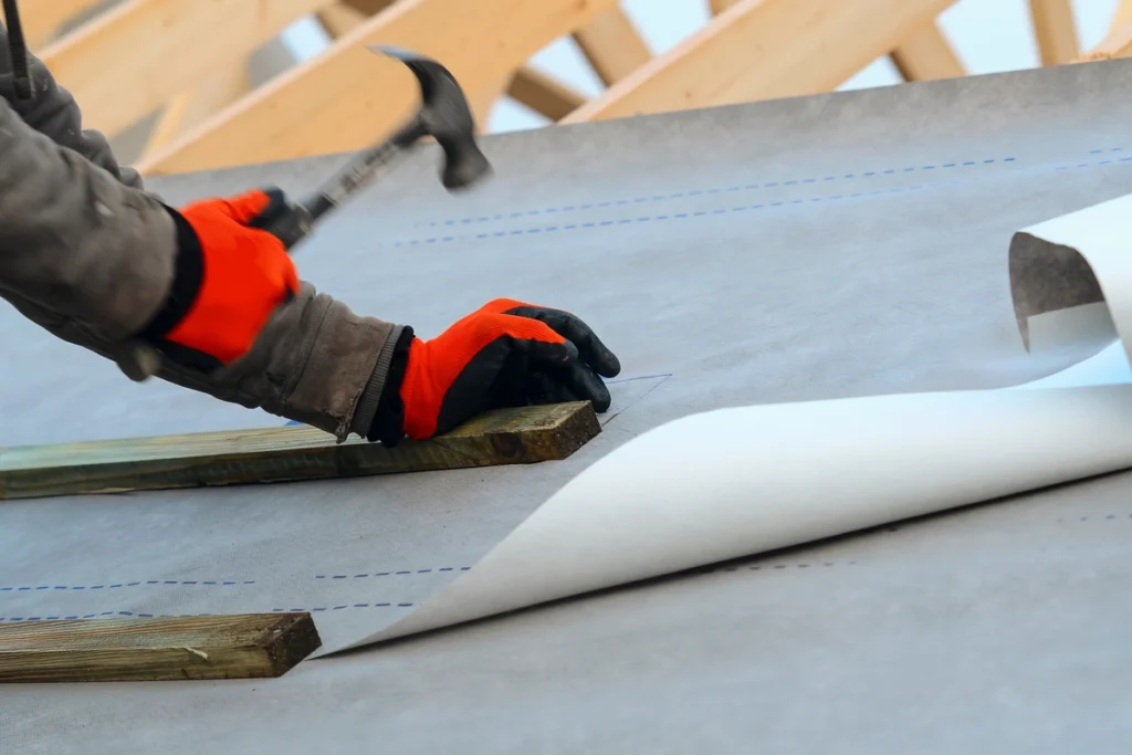 parts of a roof- close up to underlayment placing