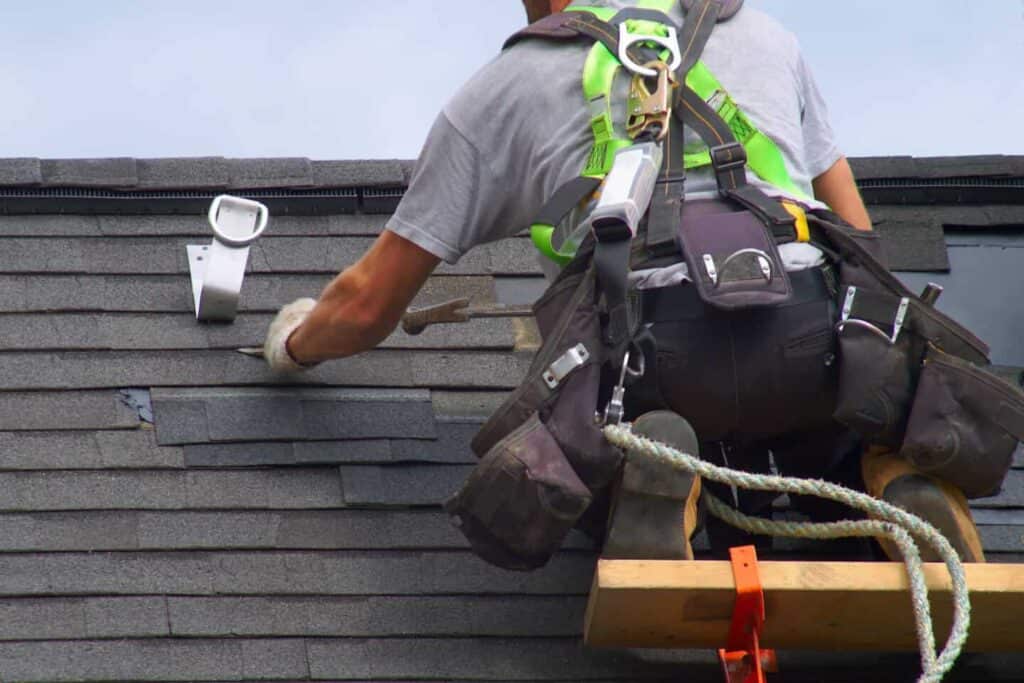 Columbus roofing contractor removing shingles from a roof