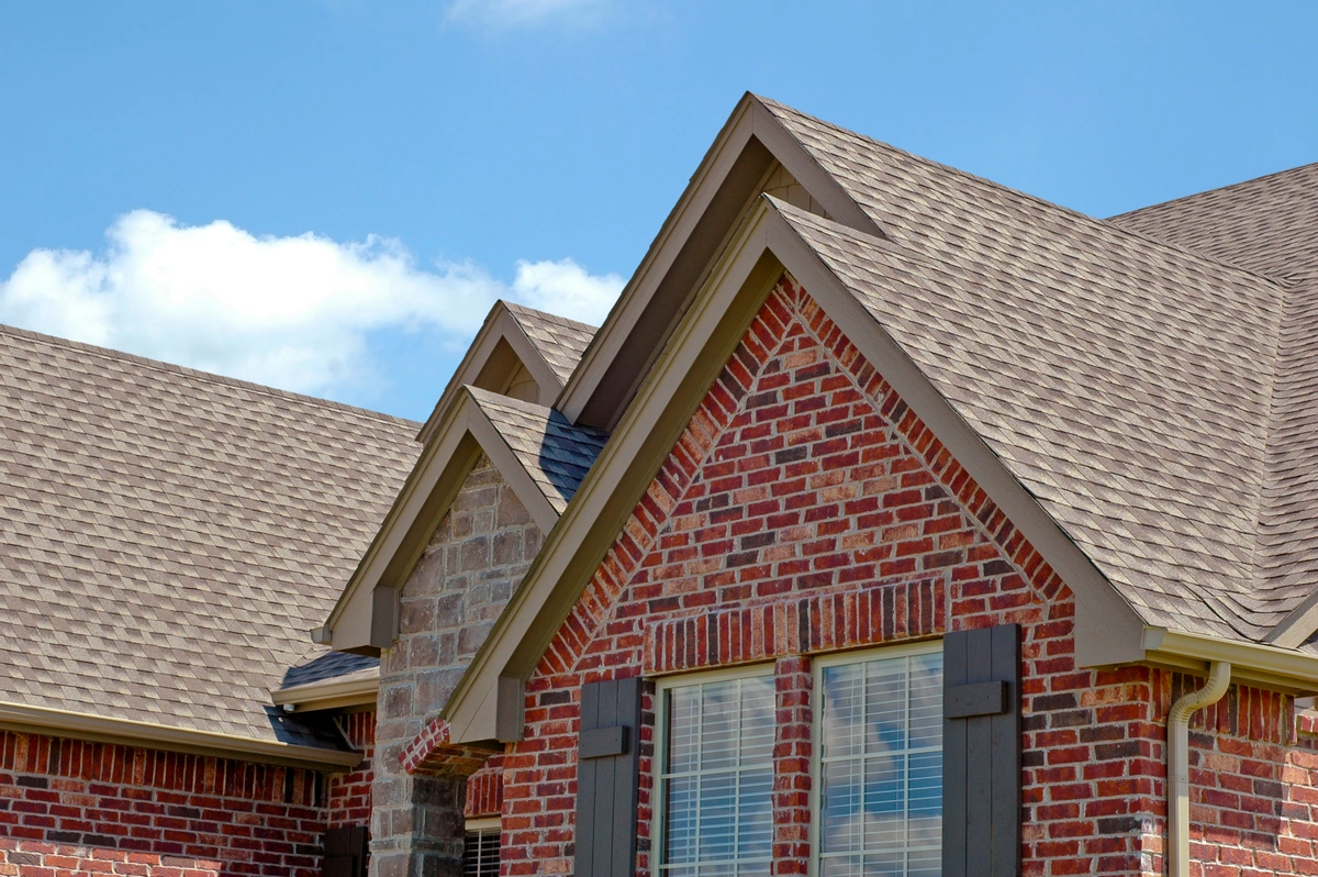 brick exterior of a home showing a new roof