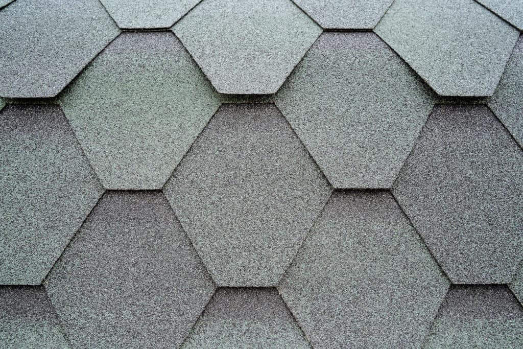 granule loss close up of architectural shingles in hexagon shape