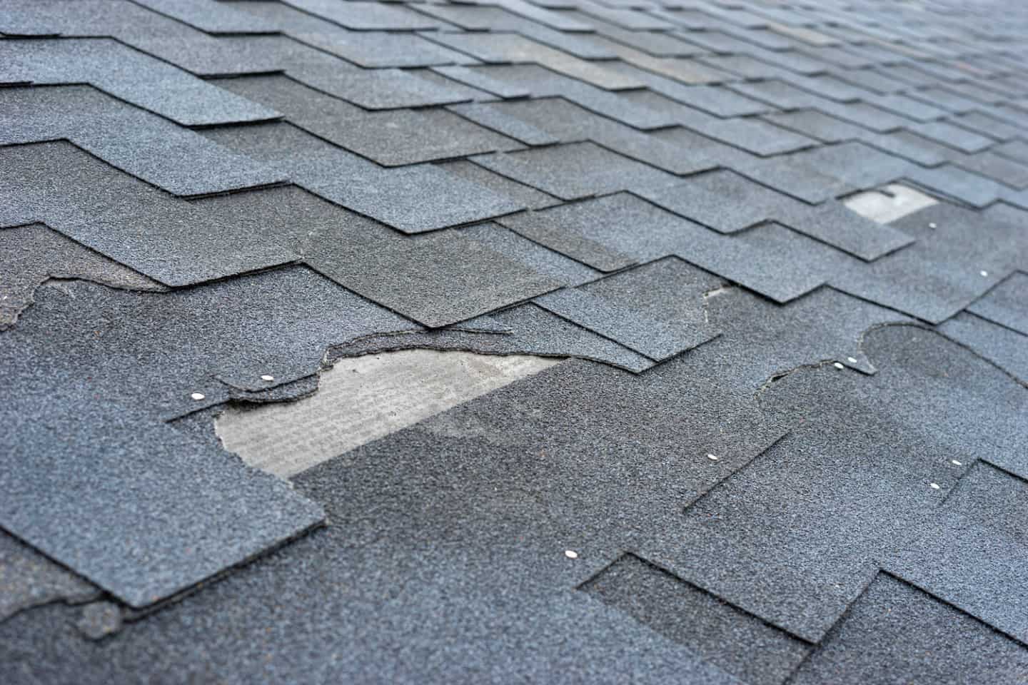 how to repair blown off roof shingles featured