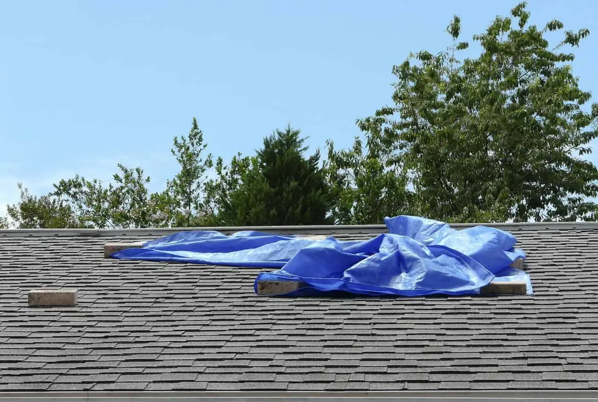 how to tarp a roof with bricks holding tarp down