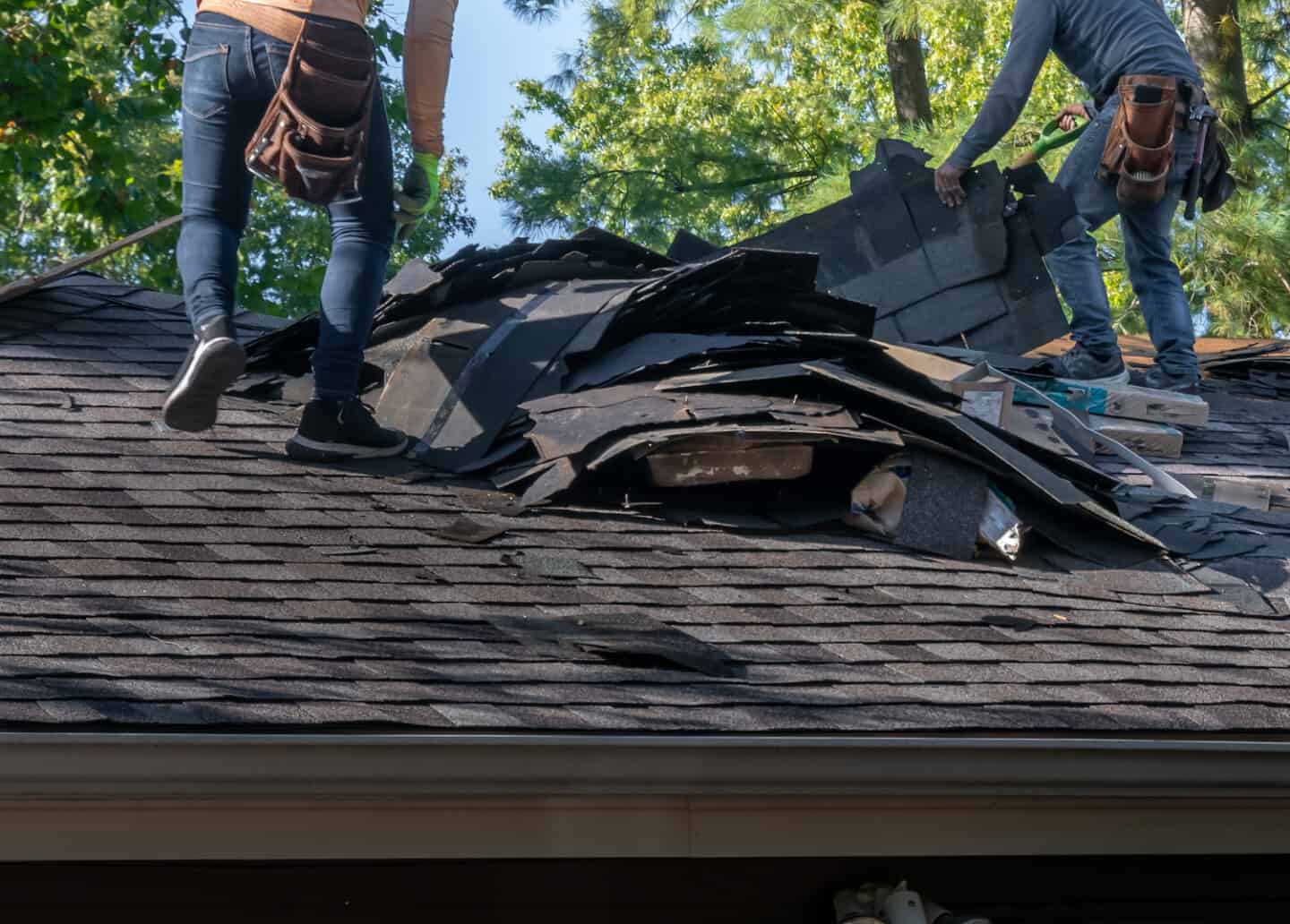 storm damage repair companies roofers torn roof