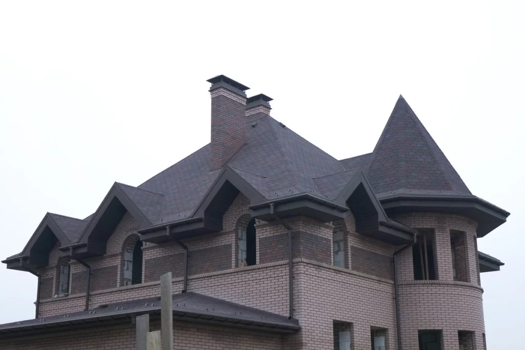 Aesthetic brick house design and dark asphalt shingle roof