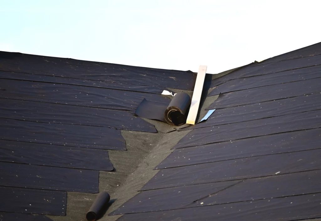 underlayment being rolled out onto a roof