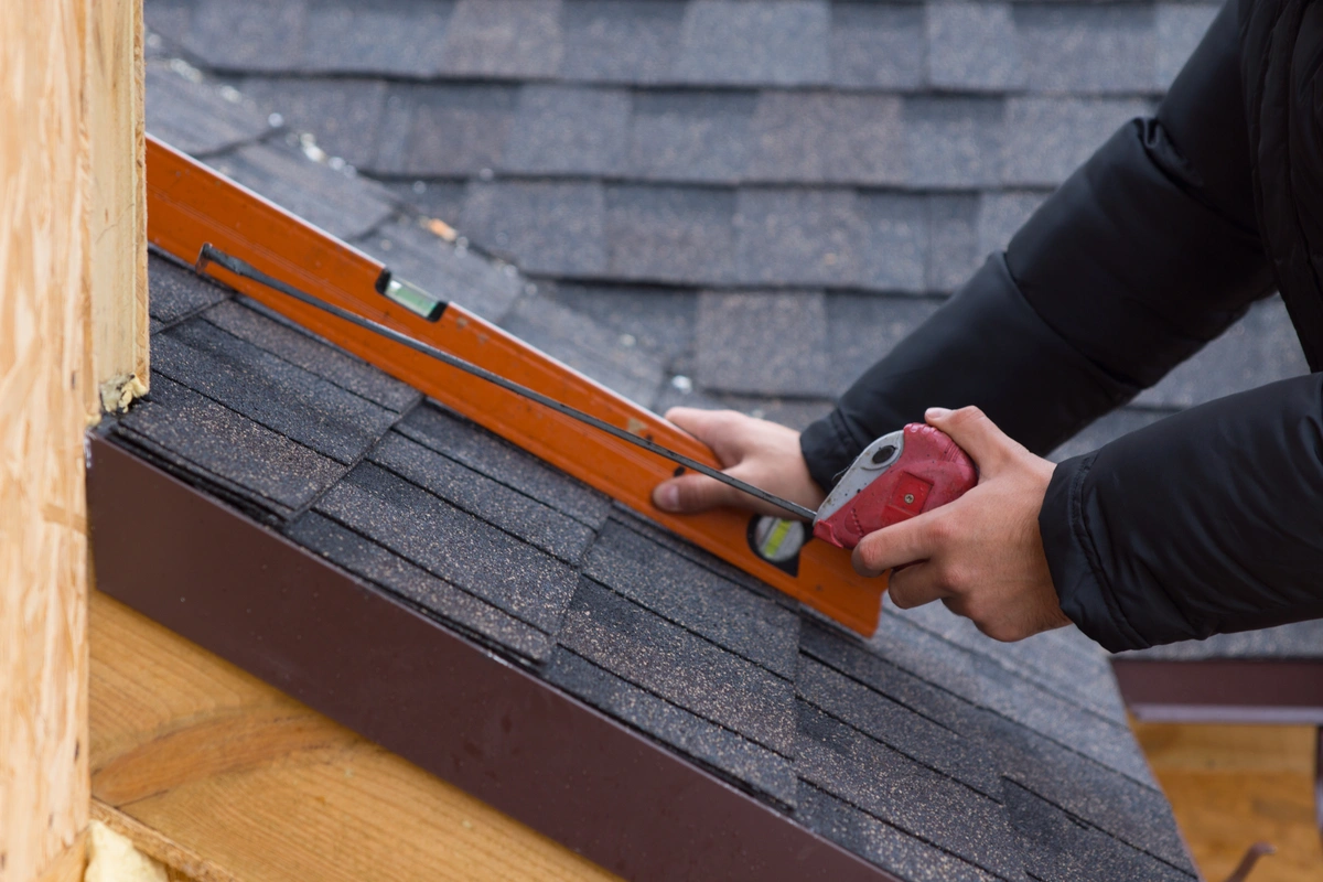 tape measure and level on a roof