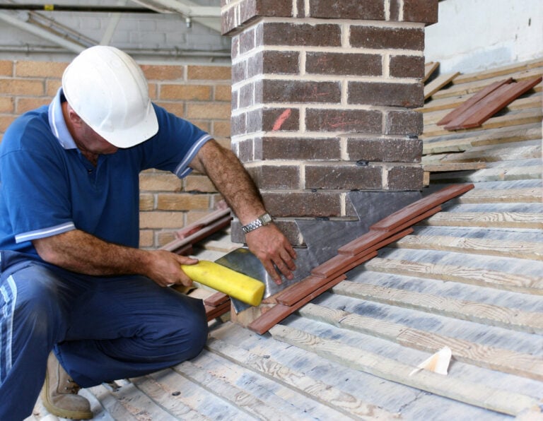 a worker is doing roof flashing