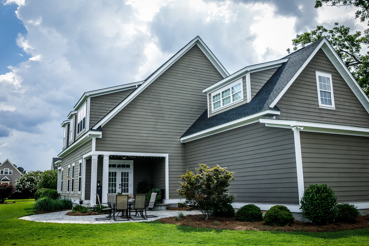 siding on the side of a home with while trim
