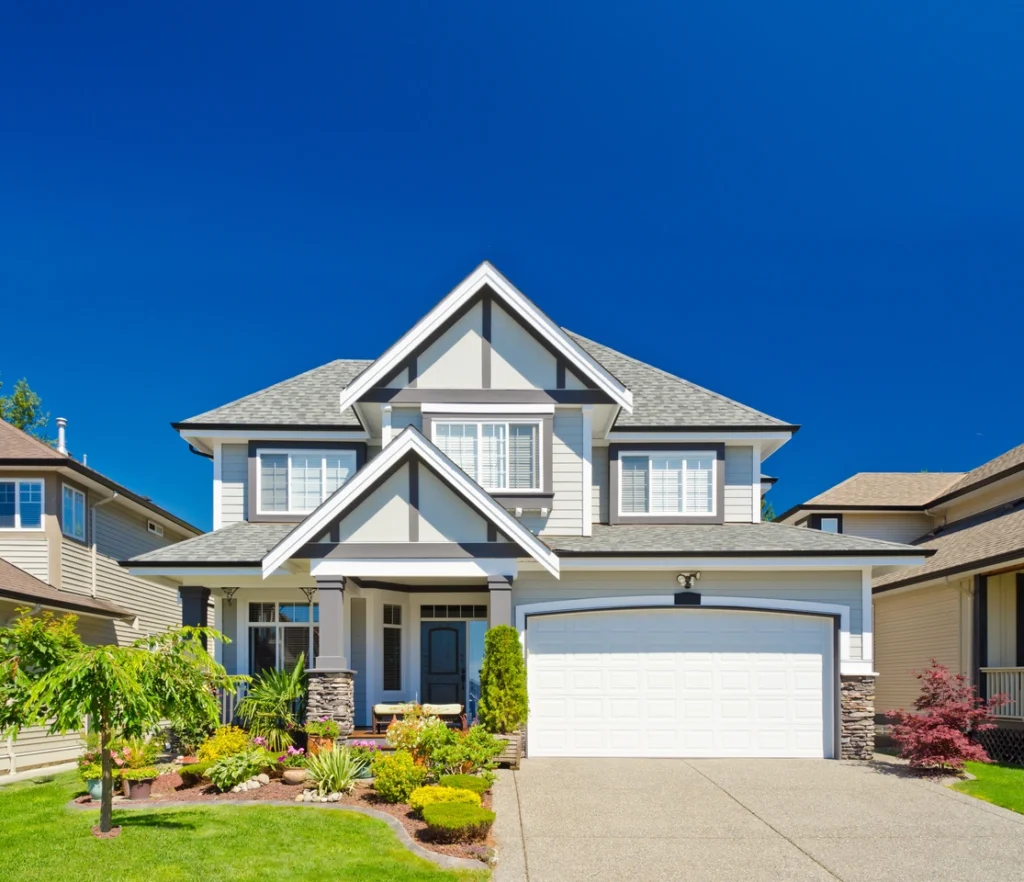 siding on a home surrounded by landscaping