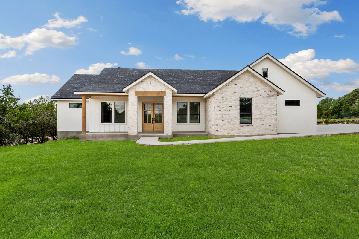 storm damage repair on a home with a green lawn
