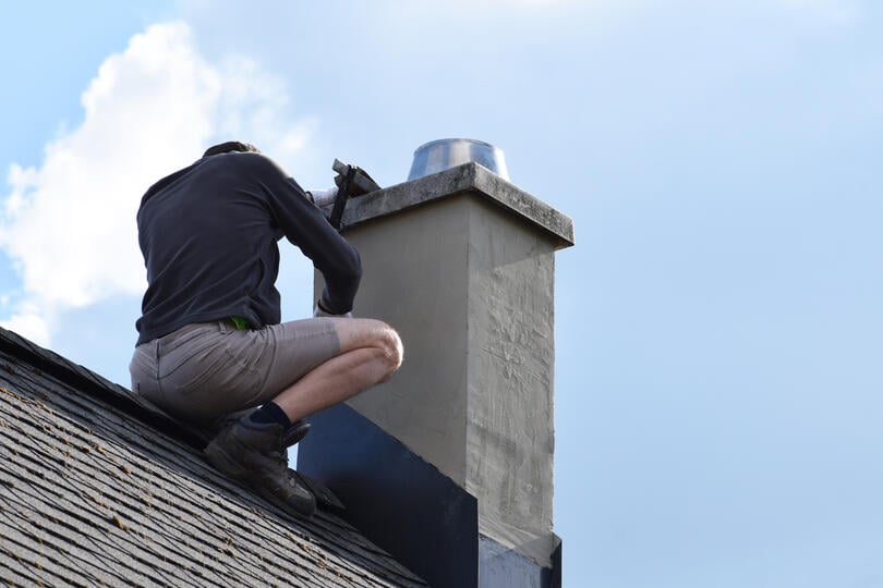 roof flashing repair-roof tech repairing chimney flashing