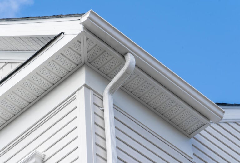soffit vent-image looking up at the underside of white soffits and other roofing materials