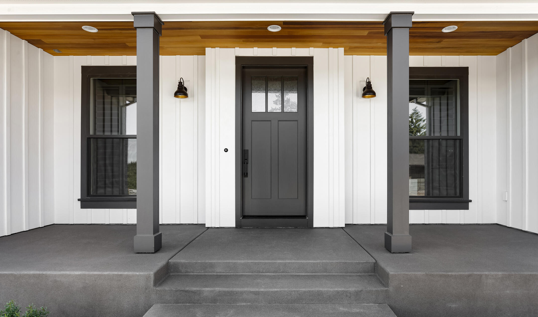 vertical siding-white vertical siding on a home with black accents