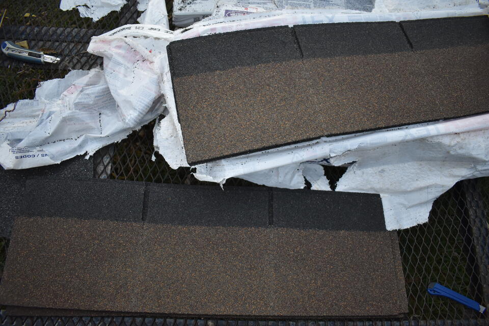how many shingles in a bundle-close up of roof shingle bundles