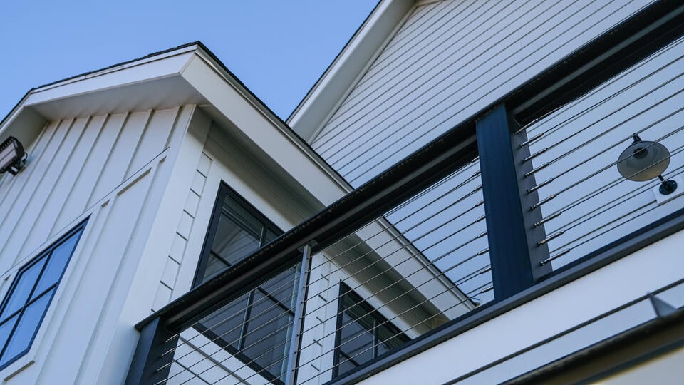 fiber cement siding vs vinyl-close up of hardie board siding on a house