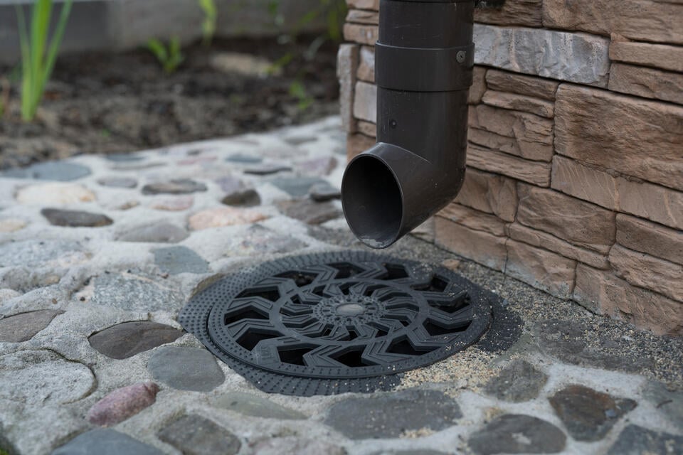 roof drain-roof drain system that empties to a drain on the ground
