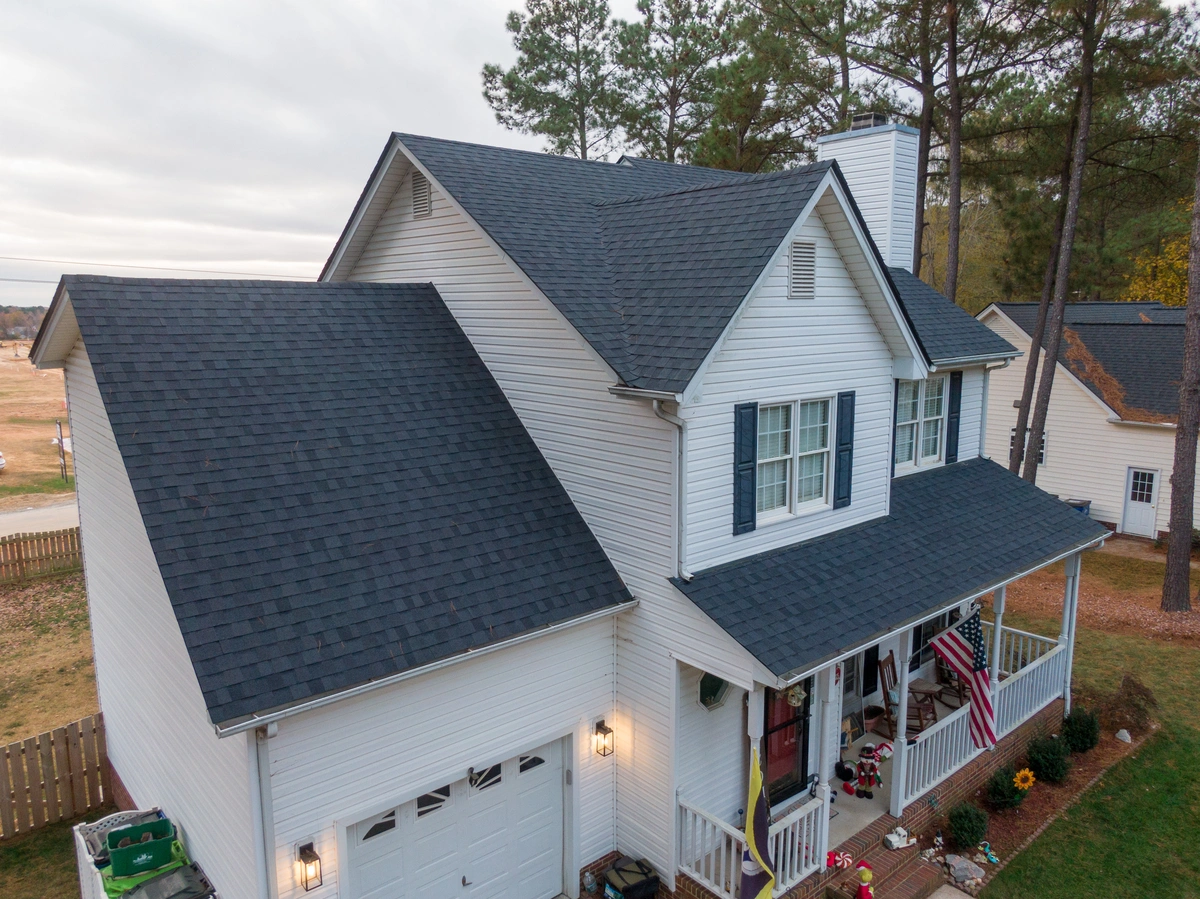 roof home with shingles