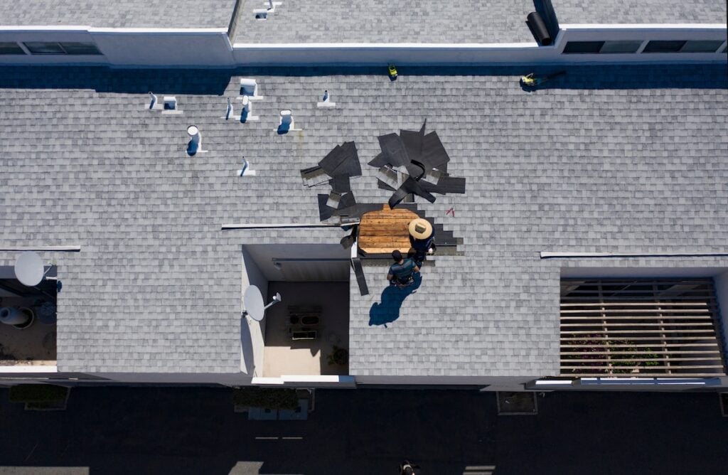 Roof Repair Inspection In Progress Aerial Above Head Condo Building Gray Shingles 2 Roofers diy roof repair